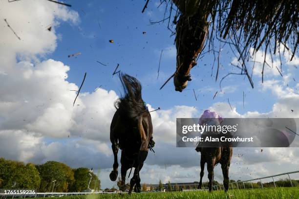 General view as runners clear the open ditch during The Download The Rhino.Bet App Novices' Handicap Chase at Huntingdon Racecourse on October 30,...