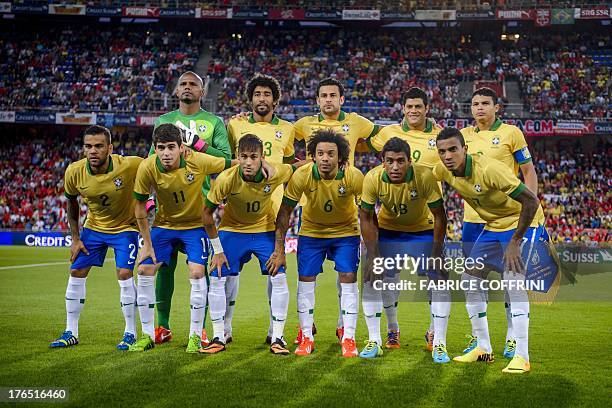 Brazil's football team players : defender Daniel Alves, midfielder Oscar, forward Neymar, defender Marcelo, midfielder Paulinho and midfielder Luiz...