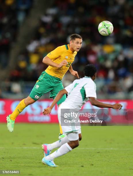 Dean Furman of South Africa heads the ball during the 2013 Nelson Mandela Challenge match between South Africa and Nigeria at Moses Mabhida Stadium...