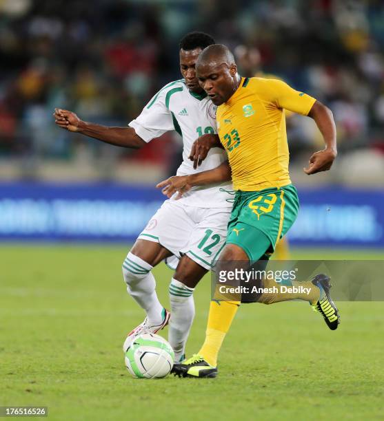 Tokelo Rantie of South Africa holds off Nnamdi Oduamadi during the 2013 Nelson Mandela Challenge match between South Africa and Nigeria at Moses...