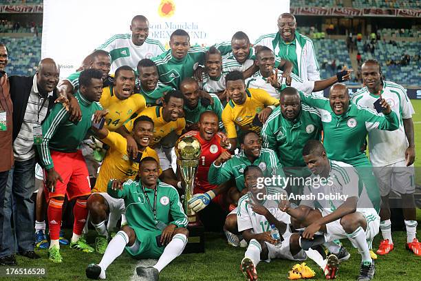 Nigeria celebrate with the trophy during the 2013 Nelson Mandela Challenge match between South Africa and Nigeria at Moses Mabhida Stadium on August...