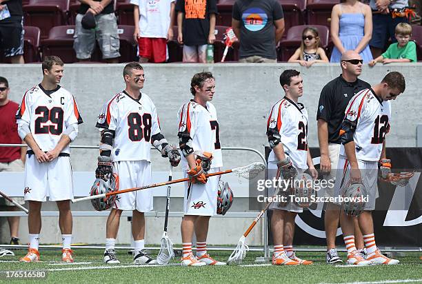 Lee Zink and Zack Greer and Matt Bocklet and Will Mangan and Justin Turri of the Denver Outlaws stand for the playing of the anthems before the start...