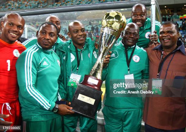 Nigeria manager Stephen Keshi with the trophy after the 2013 Nelson Mandela Challenge match between South Africa and Nigeria at Moses Mabhida Stadium...