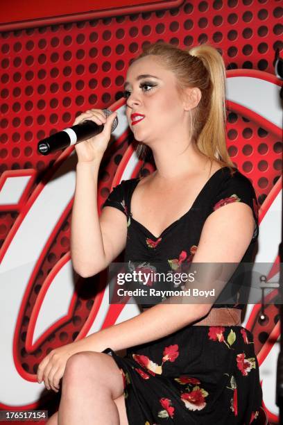 Singer Liz of Megan and Liz, performs in the KISS-FM "Coca-Cola Lounge" in Chicago, Illinois on AUGUST 12, 2013.