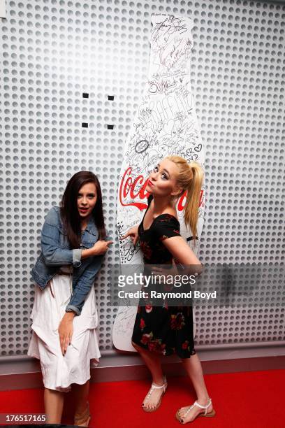 Singers and sisters Megan Mace and Liz Mace of Megan and Liz, poses for photos in the KISS-FM "Coca-Cola Lounge" in Chicago, Illinois on AUGUST 12,...