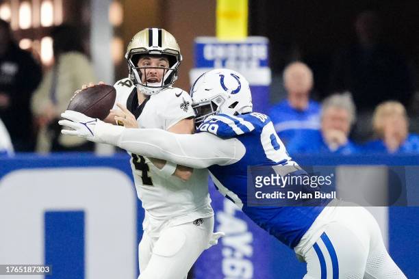 DeForest Buckner of the Indianapolis Colts forces a fumble by Derek Carr of the New Orleans Saints in the second quarter at Lucas Oil Stadium on...