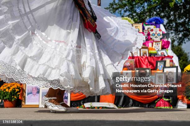 Folkloric dance group, Mixteco Ballet Folkloric, perform in front of families to celebrate the homecoming of departed loved ones during a Dia De Los...