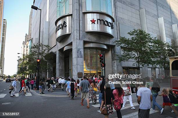 Shoppers walk past Macy's in the Magnificent Mile shopping district on August 14, 2013 in Chicago, Illinois. Macys reported lower than expected...