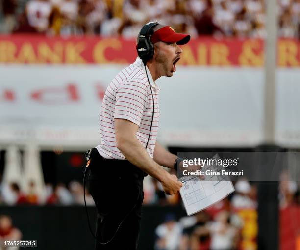 Defensive coordinator Alex Grinch yells at the defense after Washington scored on a third down and 18 yard play at the L.A. Memorial Coliseum...