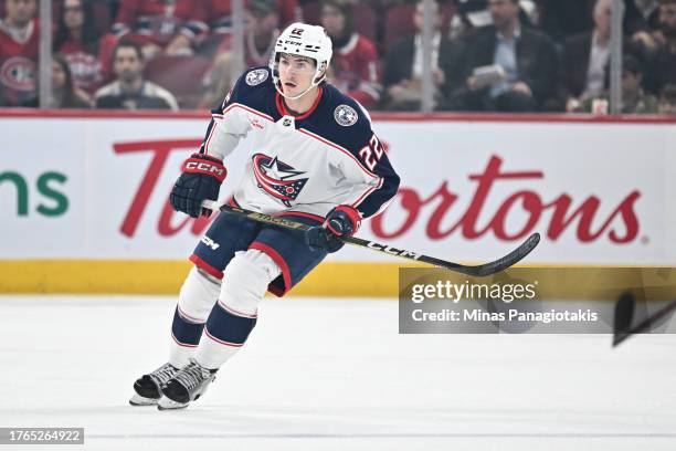 Jake Bean of the Columbus Blue Jackets skates during the first period against the Montreal Canadiens at the Bell Centre on October 26, 2023 in...