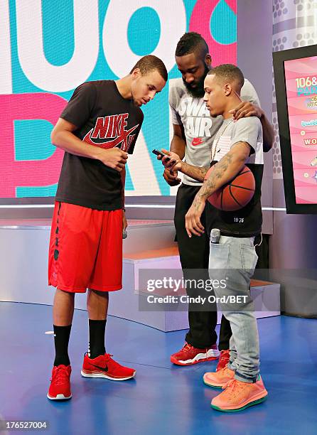Professional basketball players Stephen Curry and James Harden speak with host Bow Wow during a break at BET's '106 and Park' at BET Studios BET...
