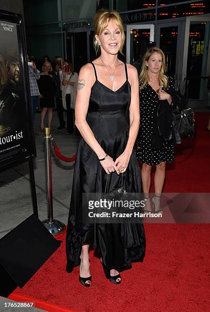 Actress Melanie Griffith arrives at the Premiere Of "Dark Tourist" at ArcLight Hollywood on August 14, 2013 in Hollywood, California.