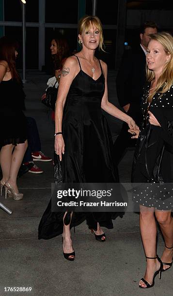 Actress Melanie Griffith arrives at the Premiere Of "Dark Tourist" at ArcLight Hollywood on August 14, 2013 in Hollywood, California.