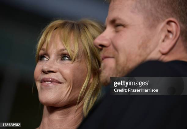 Actress Melanie Griffith and Michael Cudlitz arrive at the Premiere Of "Dark Tourist" at ArcLight Hollywood on August 14, 2013 in Hollywood,...