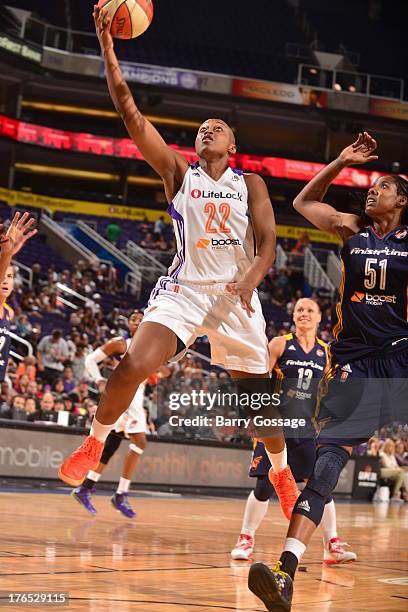 Charde Houston of the Phoenix Mercury shoots against Jessica Breland of the Indiana Fever on August 14, 2013 at U.S. Airways Center in Phoenix,...