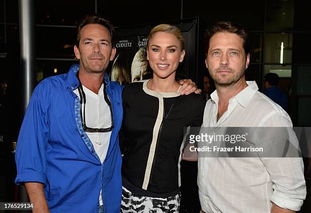 Actors Luke Perry, Jason Priestley and Naomi Lowde Priestley arrive at the Premiere Of "Dark Tourist" at ArcLight Hollywood on August 14, 2013 in...