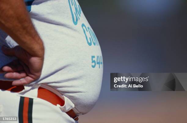 Softball, player''s bulging waistline, mid section, close-up