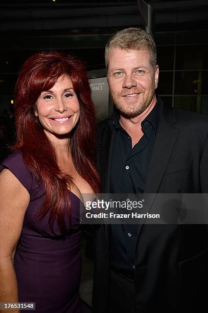 Producer Suzanne DeLaurentiis and Michael Cudlitz arrive at the Premiere Of "Dark Tourist" at ArcLight Hollywood on August 14, 2013 in Hollywood,...