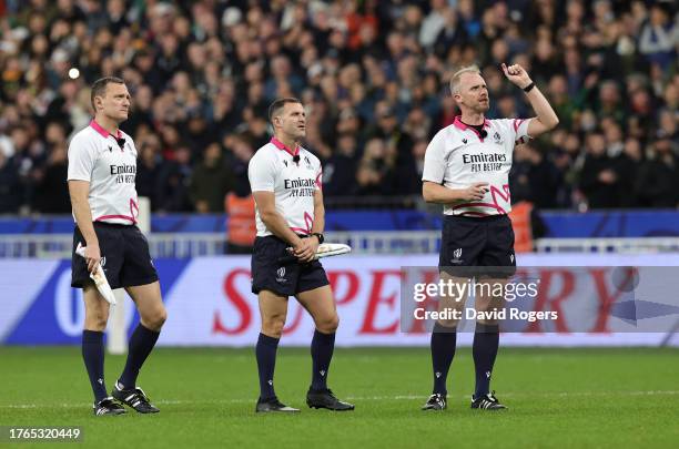 Referee Wayne Barnes and his assistants Karl Dickson and Matthew Carley look on during the Rugby World Cup France 2023 Gold Final match between New...