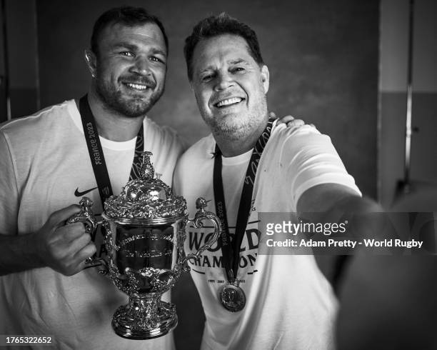 Duane Vermeulen and Rassie Erasmus, Coach of South Africa pose with the Webb Ellis Cup during the South Africa Winners Portrait shoot after the Rugby...