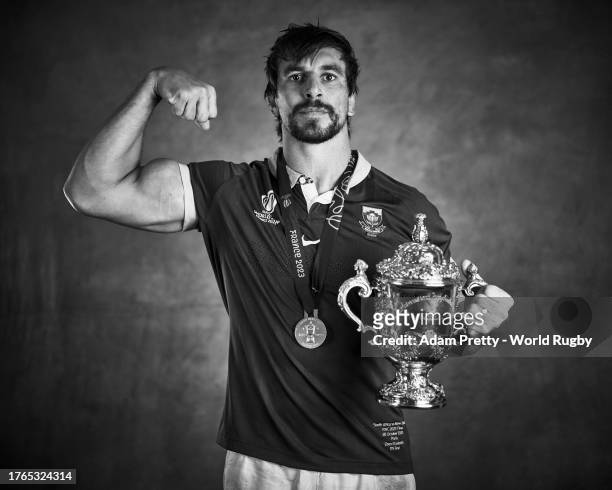 Eben Etzebeth of South Africa poses with the Webb Ellis Cup during the South Africa Winners Portrait shoot after the Rugby World Cup Final match...