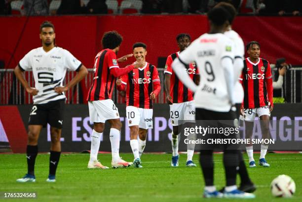 Nice's French midfielder Sofiane Diop celebrates scoring his team's second goal with teammates during the French L1 football match between OGC Nice...