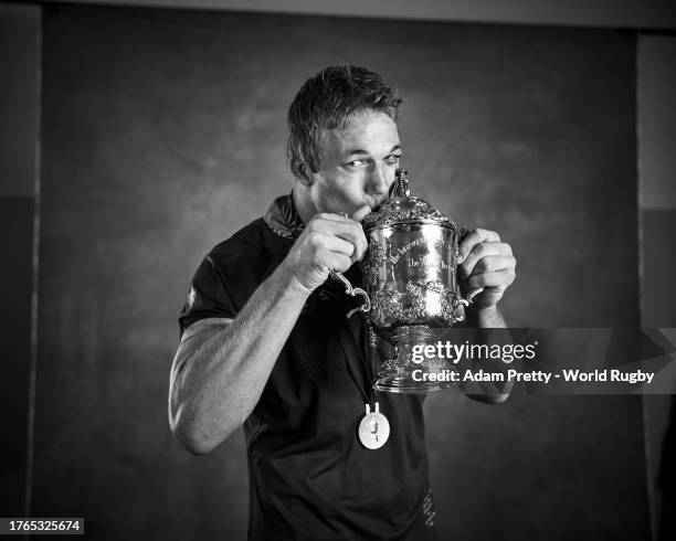 Pieter-Steph Du Toit of South Africa poses with the Webb Ellis Cup during the South Africa Winners Portrait shoot after the Rugby World Cup Final...