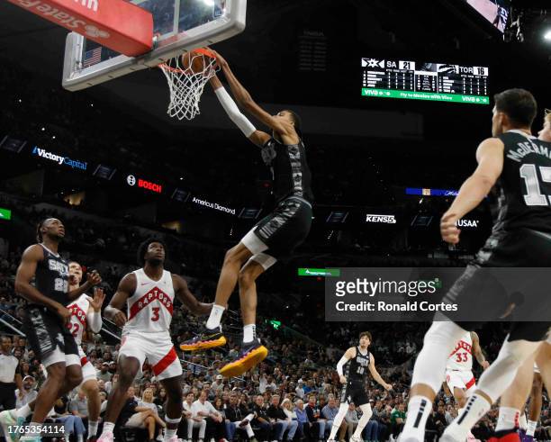 Victor Wembanyama of the San Antonio Spurs dunks against the Toronto Raptors in the first half at Frost Bank Center on November 5, 2023 in San...