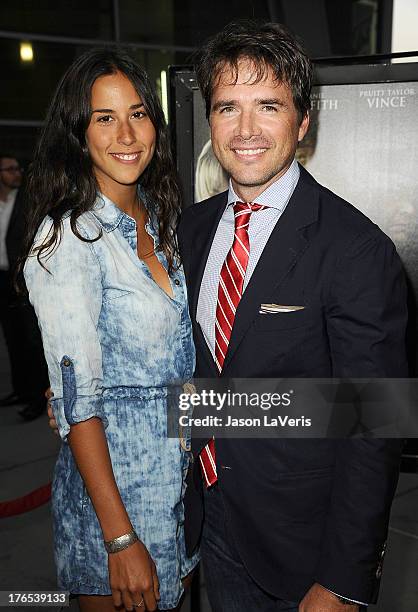 Actor Matthew Settle and Maria Alfonsin attend the premiere of "Dark Tourist" at ArcLight Hollywood on August 14, 2013 in Hollywood, California.