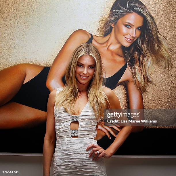 Australian model, Jennifer Hawkins poses at the launch of her new self-tanning range 'J Bronze' at Bondi Beach on August 15, 2013 in Sydney,...