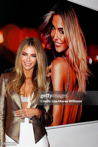 Australian model, Jennifer Hawkins poses at the launch of her new self-tanning range 'J Bronze' at Bondi Beach on August 15, 2013 in Sydney,...