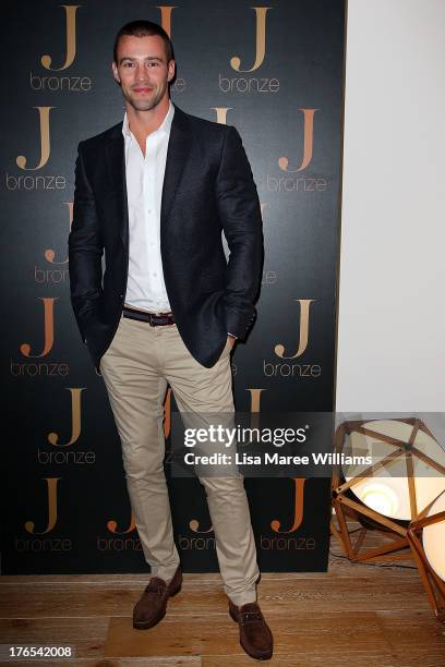 Kris Smith arrives at the launch of Jennifer Hawkins new self-tanning range 'J-Bronze' at Bondi Beach on August 15, 2013 in Sydney, Australia.