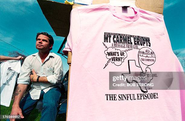 David Mevis of Waco sells souvenir t-shirts of the armed stand off at Mount Carmel on March 06, 1993 near the Branch Davidian religious compound....