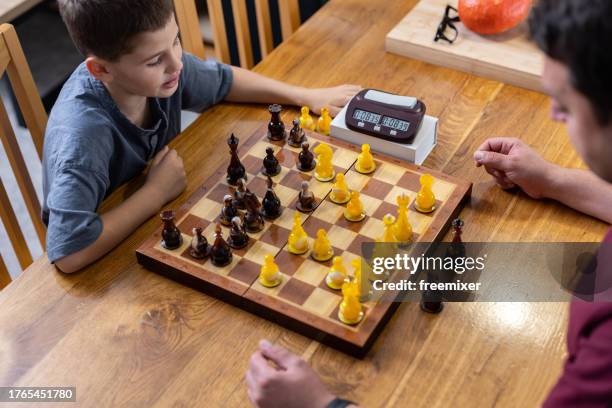 brothers playing chess - chess timer stock pictures, royalty-free photos & images