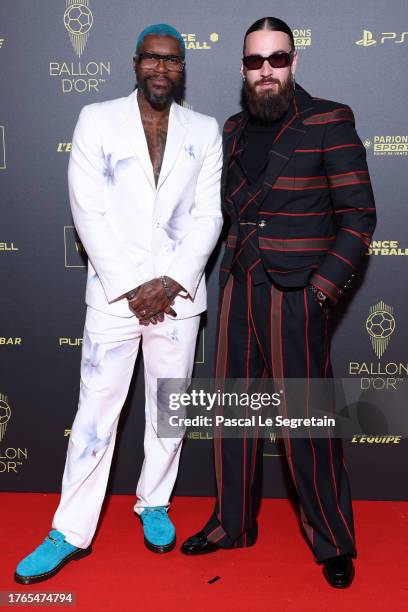 Djibril Cissé and SCH attend the 67th Ballon D'Or Photocall at Theatre Du Chatelet on October 30, 2023 in Paris, France.