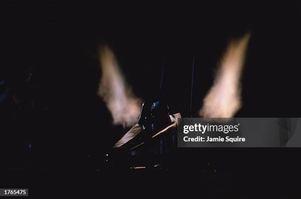 Drag racing, driver sitting in car, fumes rising from exhausts