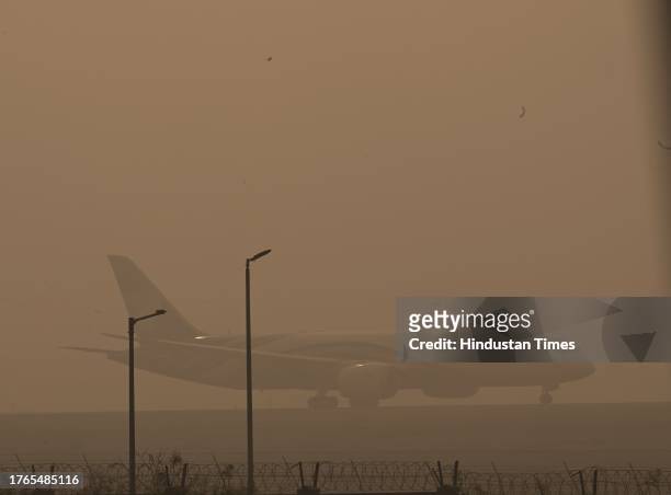 Passanger plane ready to take off at IGI Airport , Heavy smog engulf the city as AQI turns " Severe Plus " on November 5, 2023 in New Delhi, India....