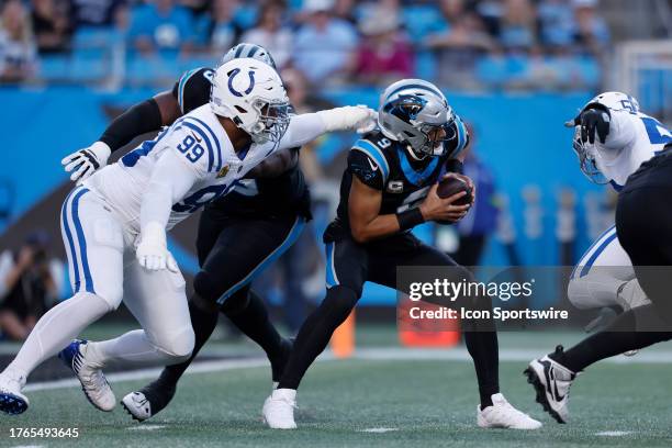 Indianapolis Colts defensive tackle DeForest Buckner reaches back for Carolina Panthers quarterback Bryce Young and gets the sack during a NFL game...