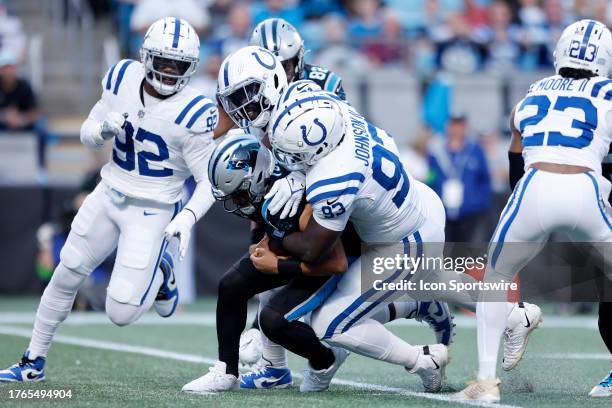 Indianapolis Colts defensive tackle Eric Johnson II and Indianapolis Colts defensive end Kwity Paye sack Carolina Panthers quarterback Bryce Young...