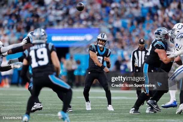 Carolina Panthers quarterback Bryce Young throws the pass to Carolina Panthers wide receiver Adam Thielen during a NFL game between the Indianapolis...
