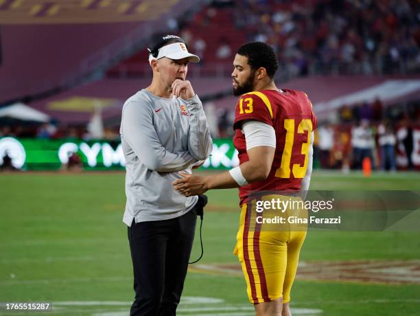 Trojans head coach Lincoln Riley talks with USC Trojans quarterback Caleb Williams during a timeout in the game against Washington at the L.A....