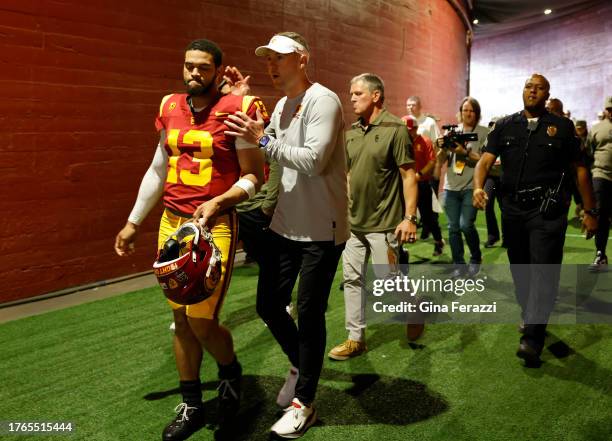 Trojans head coach Lincoln Riley walks out of the tunnel with USC Trojans quarterback Caleb Williams before the game against Washington at the L.A....