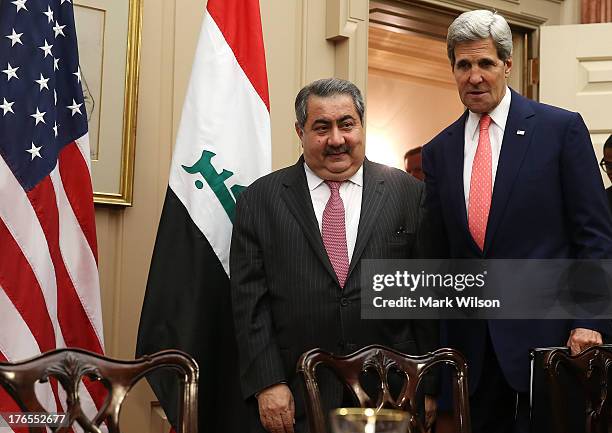 Secretary of State John Kerry and Iraqi Foreign Minister Hoshyar Zebari arrive for a meeting at the State Department August 15, 2013 in Washington,...