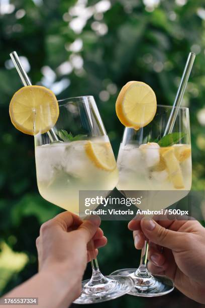 cropped hands toasting drinks,meran,italy - ice tea stock pictures, royalty-free photos & images