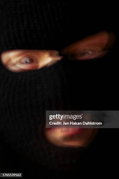 boy dressed in balaclava - skimaske stock-fotos und bilder