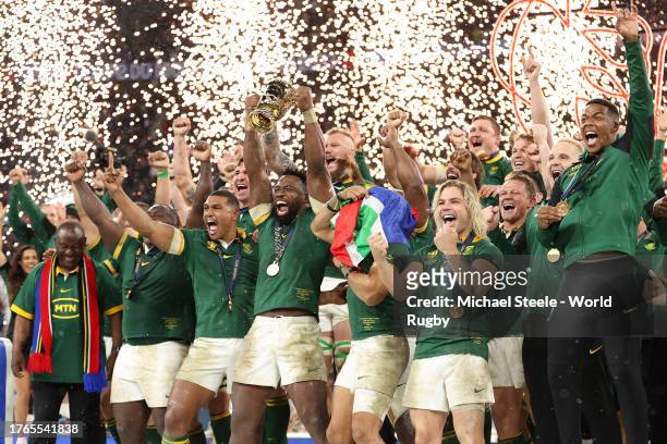 Siya Kolisi of South Africa lifts The Webb Ellis Cup following the Rugby World Cup France 2023 Gold Final match between New Zealand and South Africa...