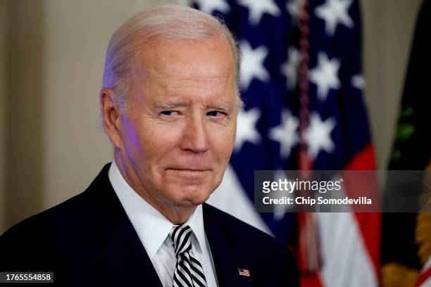 President Joe Biden listens as Vice President Kamala Harris introduces him during an event about his administration's approach to artificial...