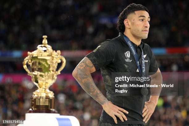 Rieko Ioane of New Zealand walks past The Webb Ellis Cup following the Rugby World Cup France 2023 Gold Final match between New Zealand and South...