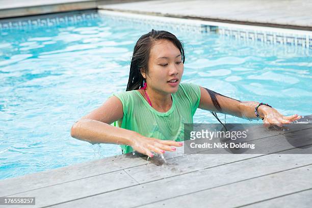 pool party 38 - women in wet tee shirts stock pictures, royalty-free photos & images