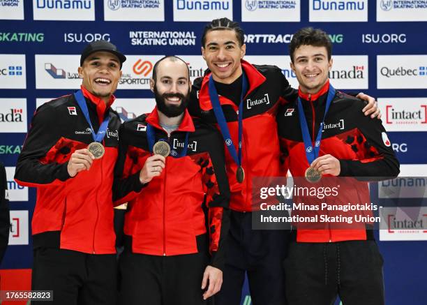 Team Canada pose with their bronze medals after finishing third in the men's 5000 m relay final during the ISU Four Continents Short Track Speed...